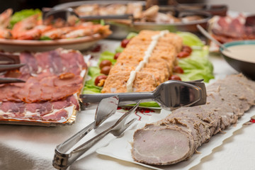 table full of plates of food in a Christmas buffet