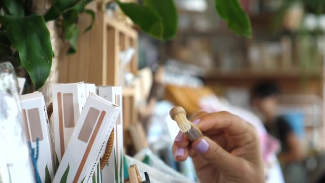 Customer Choosing Wooden Eco-Friendly Recycle Natural Bamboo Toothbrush In Eco Store