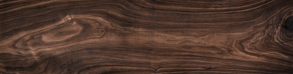 Super long walnut planks texture background.Dark tone walnut texture,Walnut natural texture.