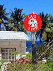 a sign bus stop overlooking the sea - Barbados
