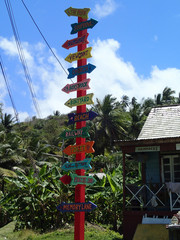beautiful colorful house in Barbados with colorful signposts
