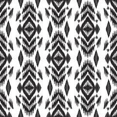 Seamless pattern for home decor ideas. Ikat chevron wallpaper. Ethnic, indian, aztec fashion style. Pillow textile decoration. Tribal background. Black and white graphic design.