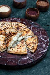 Turkish pizza served on the vooden plate