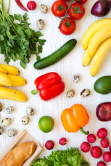 Colorful pattern of health food on a white wooden background. Healthy eating. Top view. From above. Flat lay.