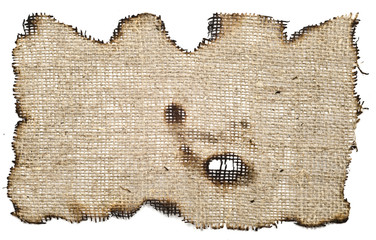 old, burnt on the edges of the fabric