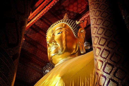 big gold buddha image statue at temple, Thailand