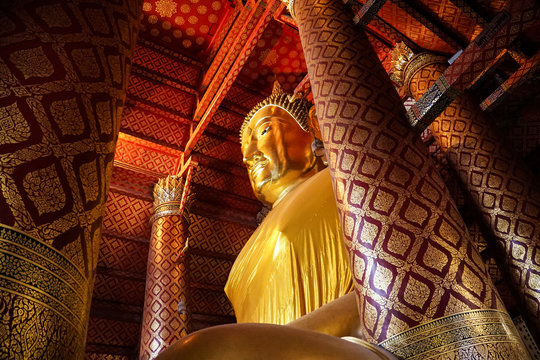 big gold buddha image statue at temple, Thailand