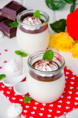 Traditional Italian dessert panna cotta with chocolate sauce and crispy meringue, dessert for...