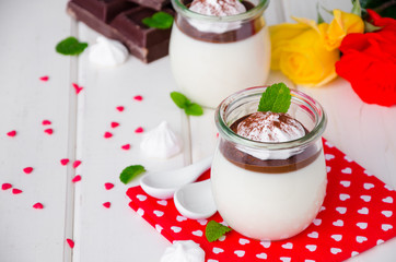 Traditional Italian dessert panna cotta with chocolate sauce and crispy meringue, dessert for...