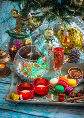 Christmas still life with glass of wine and macaroons
