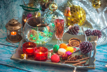 Obraz na płótnie Canvas Christmas still life with glass of wine and macaroons