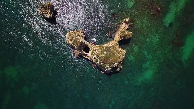 Aerial. Beautiful Portuguese beaches and shores of the city of Lagos. View from the sky, Algarve.