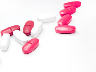 Obraz na płótnie Canvas colorful medical pills, on white background, closeup
