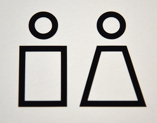 schwarzes Piktogramm auf weißem Untergrund: Frauen- und Herrentoilette (WC)
