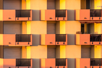 Morning sun on orange and yellow balconies