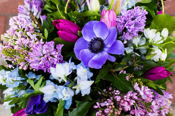 Woman holding beautiful bouquet of flowers
