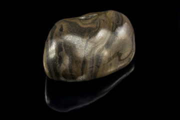 Colorful stone with different designs and colors and black background