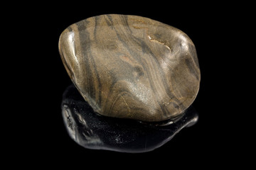 Colorful stone with different designs and colors and black background