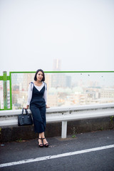 Japanese female model posing for the pictures on the street of Tokyo, Japan. Many artists are living in Tokyo to improve their works of art.