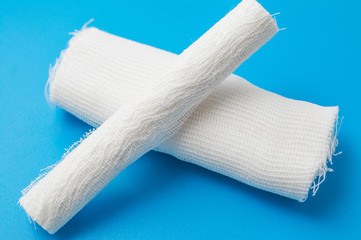 two medical bandage over blue background