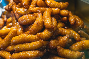 Fried sicilian Zeppole (or crispelle).. Street food typical of Sicily, prepared with rice, flour,...