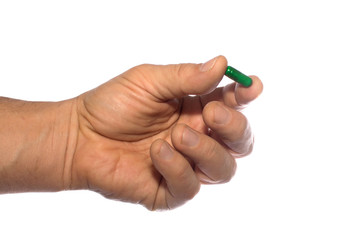 hand with pill isolated on white