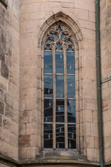 Fototapeta na wymiar Big window of an old historical building