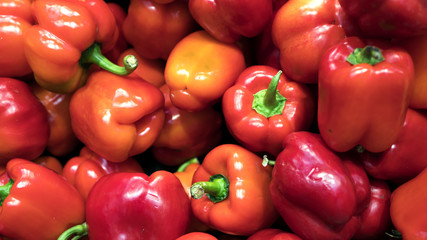 Red fresh bell pepper or capsicum in the market used for your pattern or your background design. Food and healthy care concept