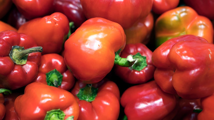 Red fresh bell pepper or capsicum in the market used for your pattern or your background design. Food and healthy care concept