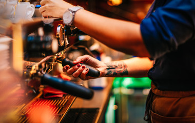 Person Worker Employee Staff Preparing Coffee Espresso on Coffee Machine Inside of a Bar at Work Coffeehouse Background