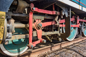 Fototapeta na wymiar Detail of the wheels of an old steam locomotive