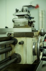 Obraz na płótnie Canvas Lathe machine for metal cutting, machinery center background.
