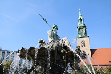 St. Mary's Church and Neptune's Fountain at Alexanderplatz in Berlin, Germany © ClaraNila