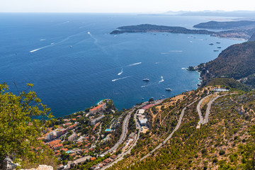 Naklejka premium South France, Cote-Dazur, Cap Dail, island Cap Ferrat, a lot of boats, red color of roofs, Road serpentine, mountain road, aerial view from La Turbie, view point of Monaco, deep blue sea, sunny