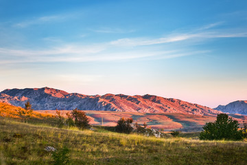 Mountains view with hills and colors sky, colors mountains and mountains background, Durmitor on the way to Black Lake - Crno Lake, from Zhablyak, beauty sunset 