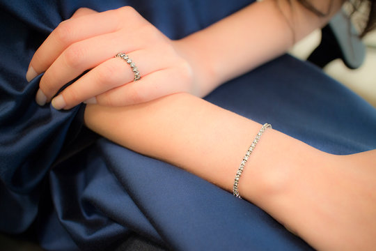 hand with diamong ring and wristlet
