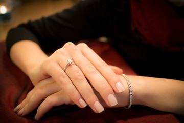 hands with wedding rings and wristlet