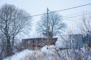 Russia, Zaraysk - Janyary, 4, 2019: the image of rural lodges in Zaraysk in snowfall
