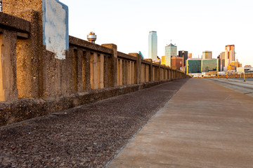 Low angle of Houston Street Viaduct with the city of Dallas in background