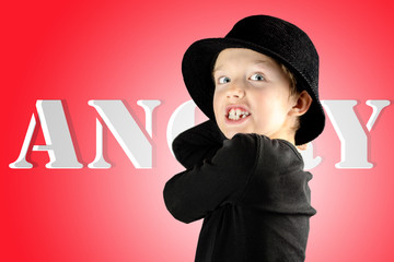 closeup of young boy with heavy furious and angry expression with crazy look