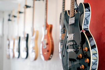 Closeup shot of electric guitar hang on the wall