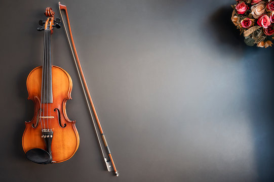 Top view of violin musical on blue background with copy space.