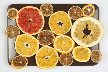 mix different pieces of dried citrus fruit on a plate