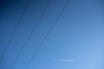 Sky background with electric cables crossing the image.