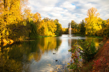 Fototapeta premium Autumn at Prosna River, in Kalisz, one of the oldest cities in Poland. 