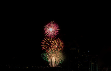Colorful fireworks display over city . Firework celebration sparkling in midnight sky, countdown , khonkaen, Thailand