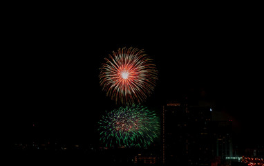 Fototapeta premium Colorful fireworks display over city . Firework celebration sparkling in midnight sky, countdown , khonkaen, Thailand