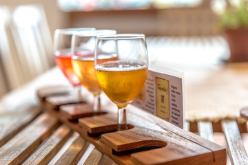 Glasses of cider in a wood table in Norway