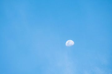 Half moon in twilight.