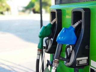 gas pump nozzles in station